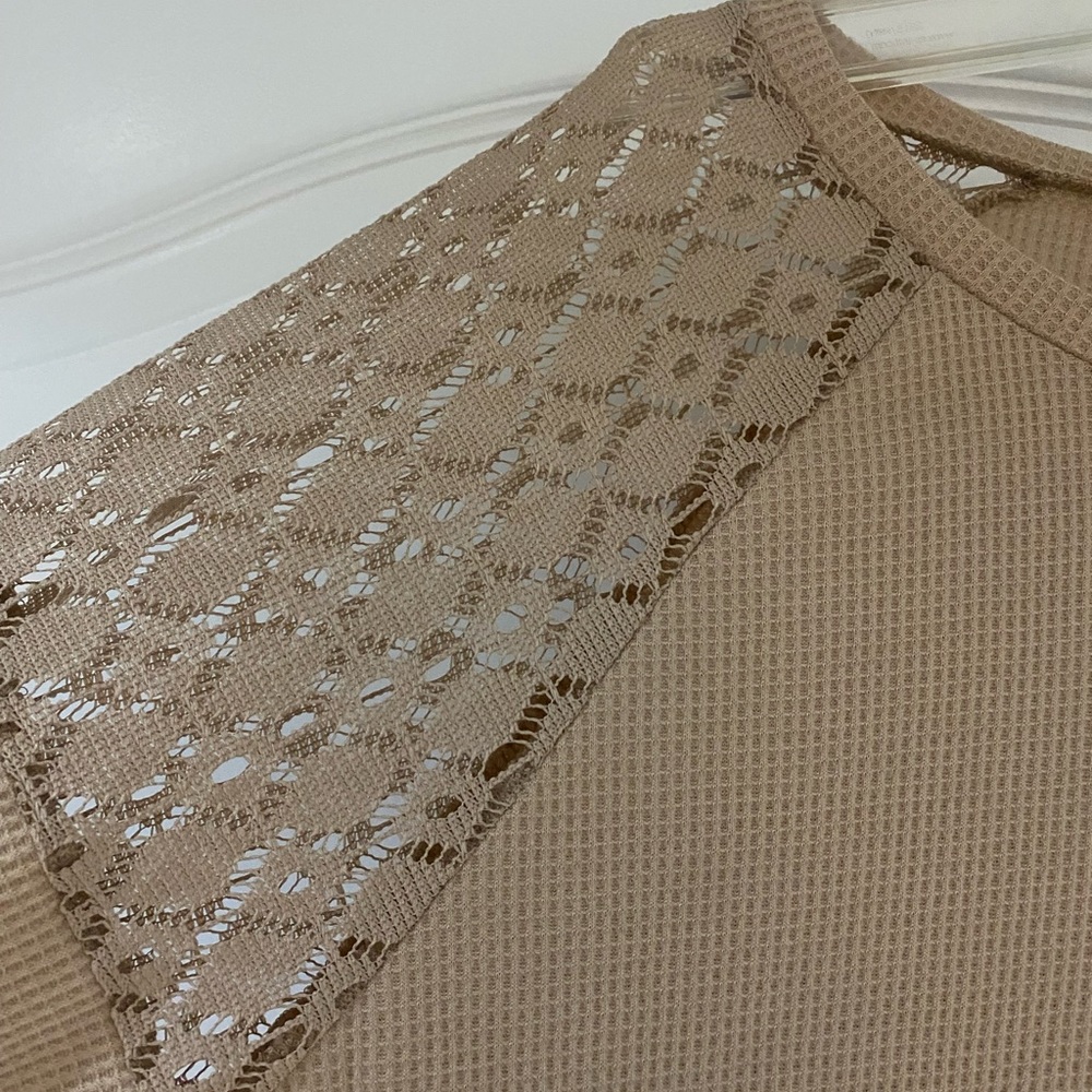 Purchased from a boutique M/L very flattering with jeans or white shorts or jean